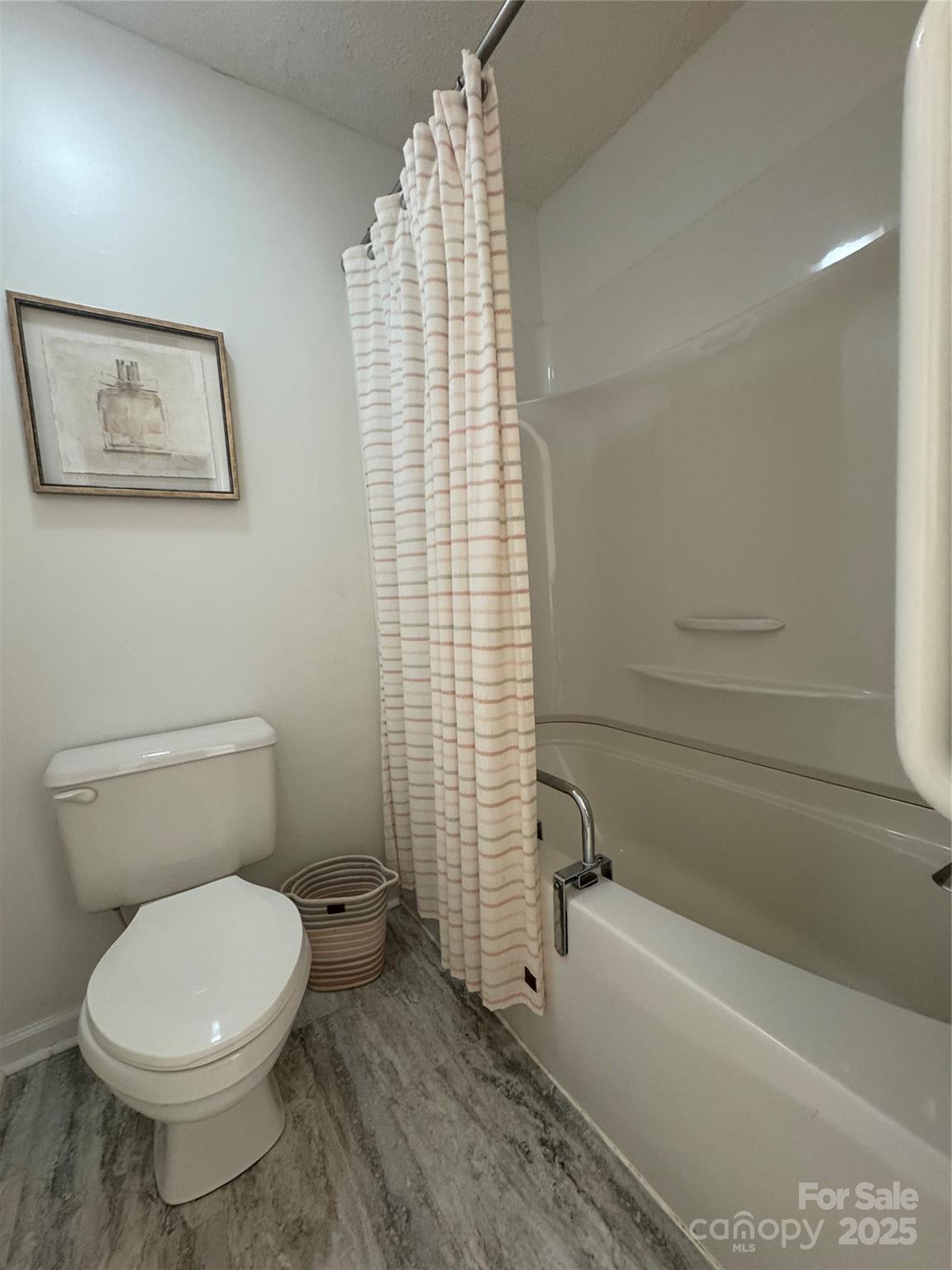 21120 Cold Spring Lane Cornelius, NC 28031 - Photo 18 of 22 a bathroom with a toilet and a bath tub