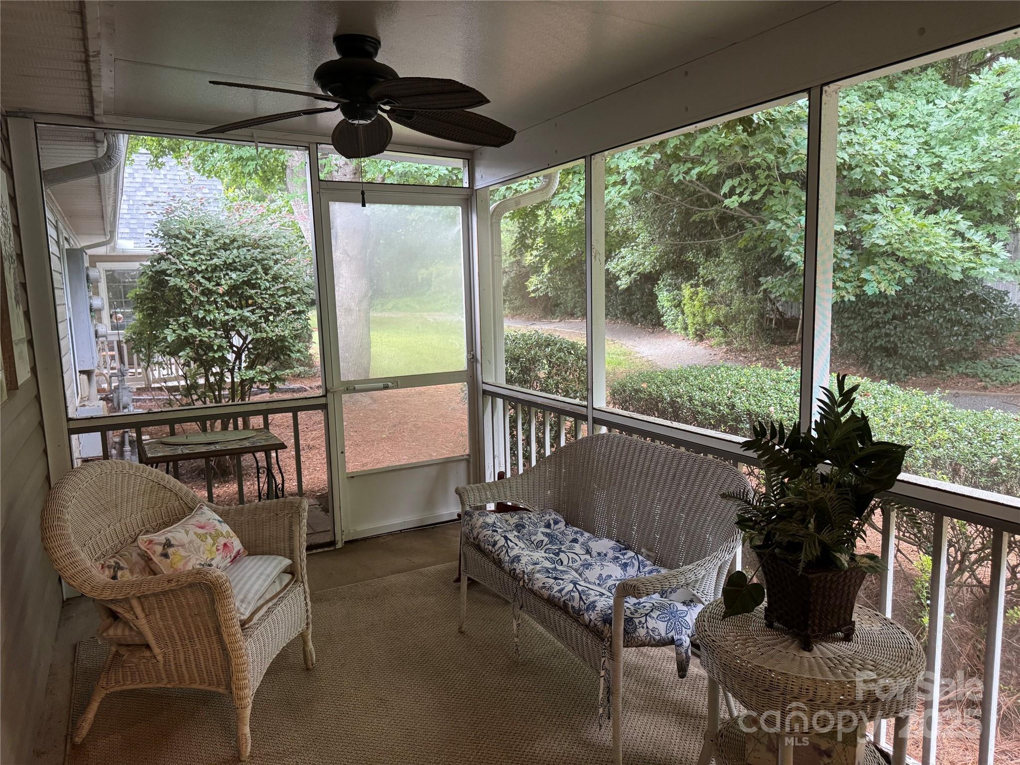 21120 Cold Spring Lane Cornelius, NC 28031 - Photo 19 of 22 a balcony with furniture and a potted plant