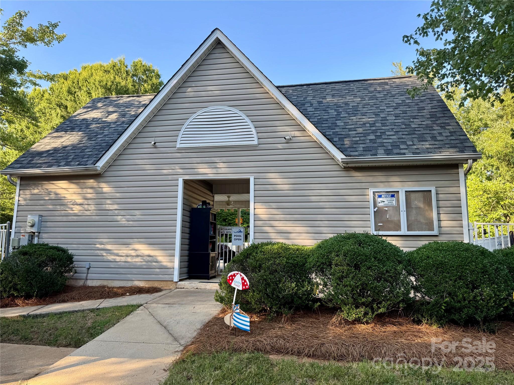 21120 Cold Spring Lane Cornelius, NC 28031 - Photo 20 of 22 a front view of a house with a garden