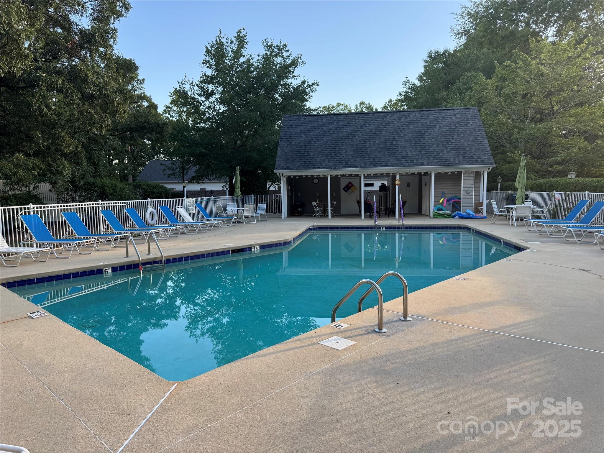 21120 Cold Spring Lane Cornelius, NC 28031 - Photo 21 of 22 a view of a house with pool backyard and chairs