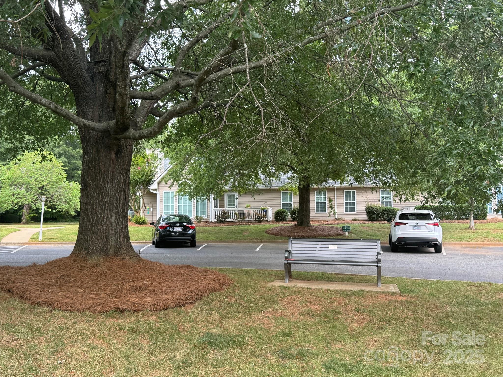 21120 Cold Spring Lane Cornelius, NC 28031 - Photo 3 of 22 a view of a yard with car parked