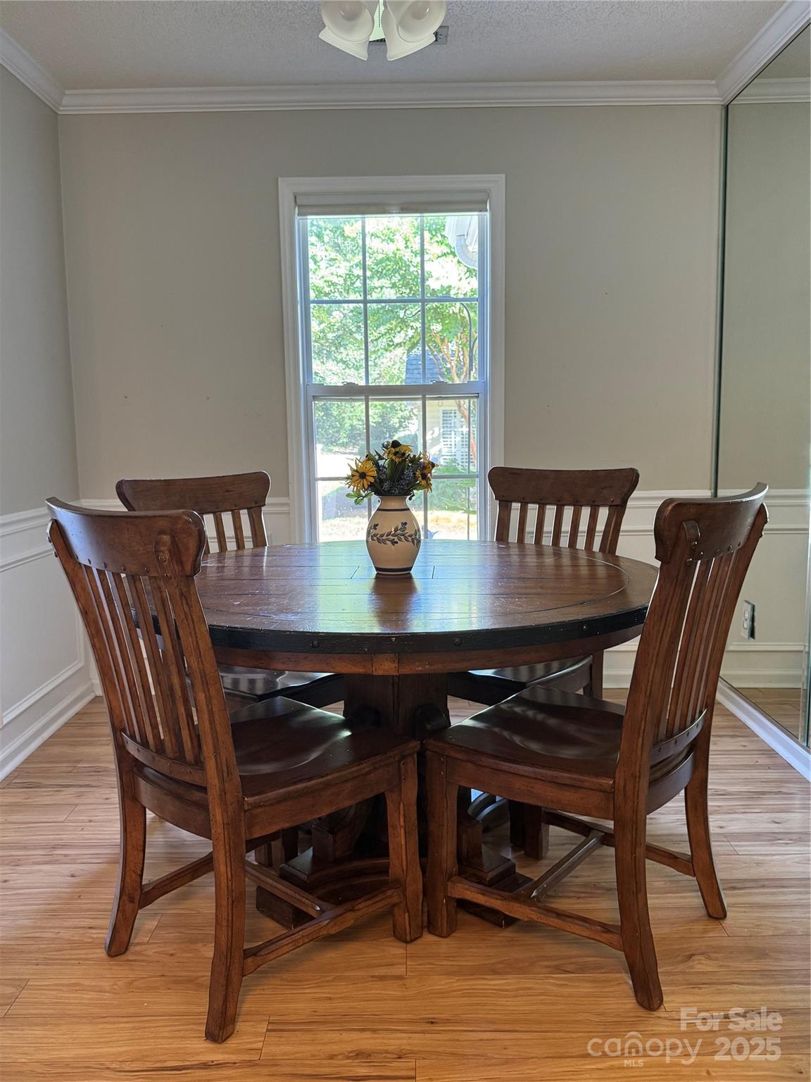 21120 Cold Spring Lane Cornelius, NC 28031 - Photo 8 of 22 a view of a dining room with furniture window and wooden floor