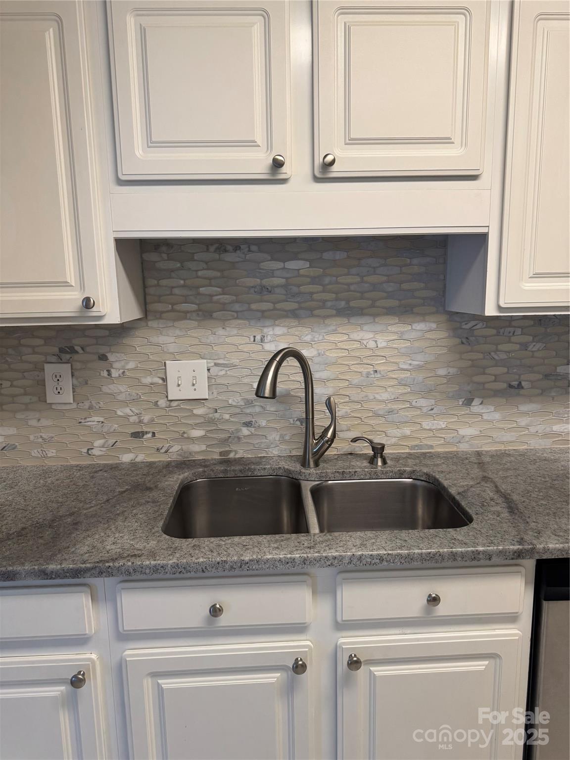21120 Cold Spring Lane Cornelius, NC 28031 - Photo 10 of 22 a sink with white cabinets