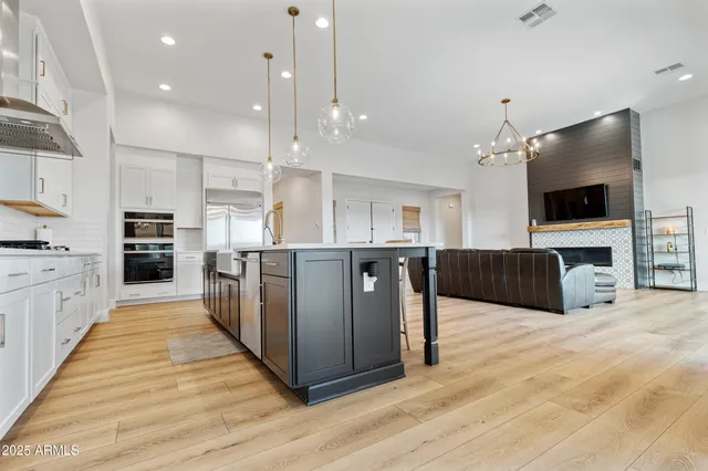 a white bath tub sitting next to a bathroom sink
