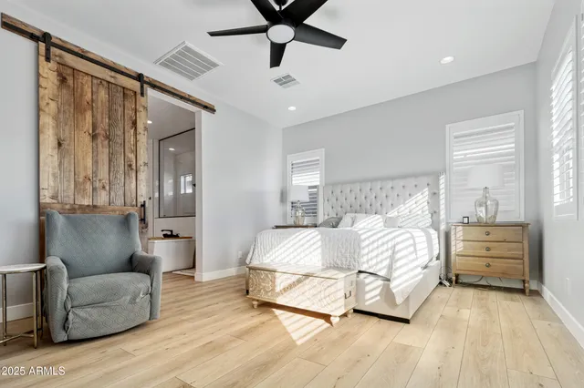a bedroom with furniture and white walls