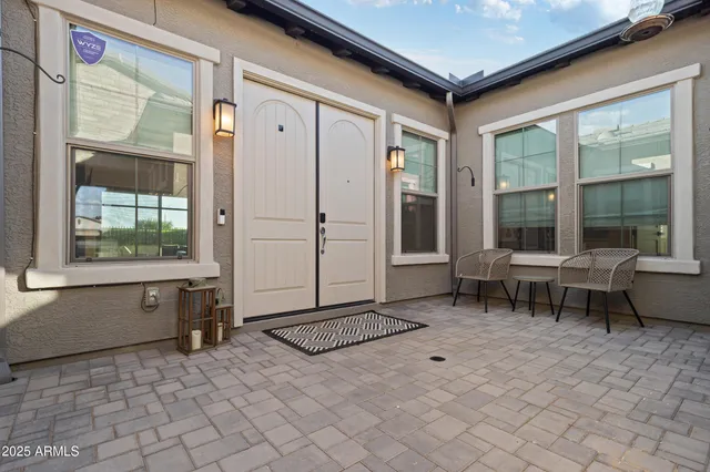 a view of a backyard with plants and a garden