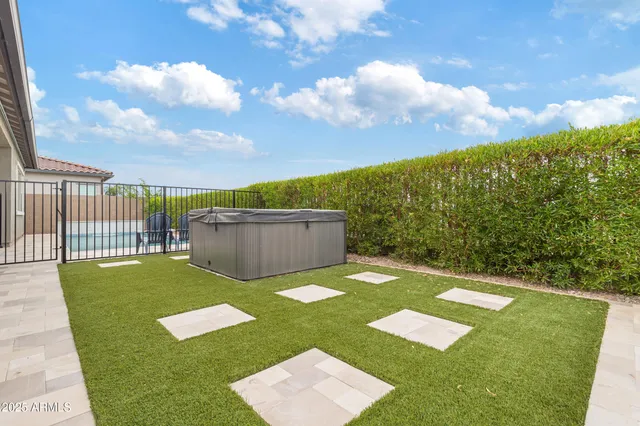 a view of a swimming pool with a table and chairs