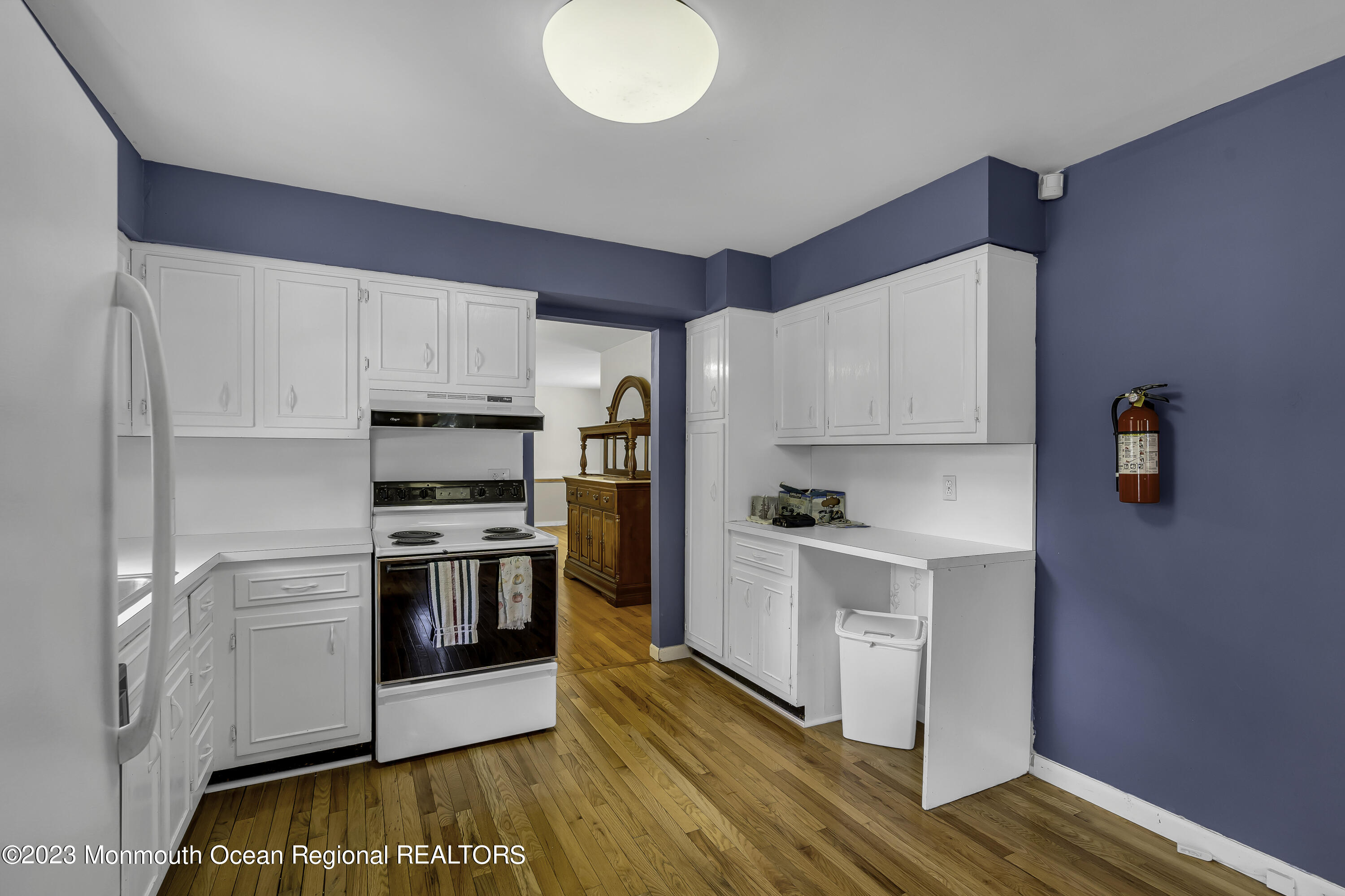 388 Cherry Quay Road Brick, NJ 08723 - Photo 12 of 35 a kitchen with stainless steel appliances a stove a sink and a refrigerator