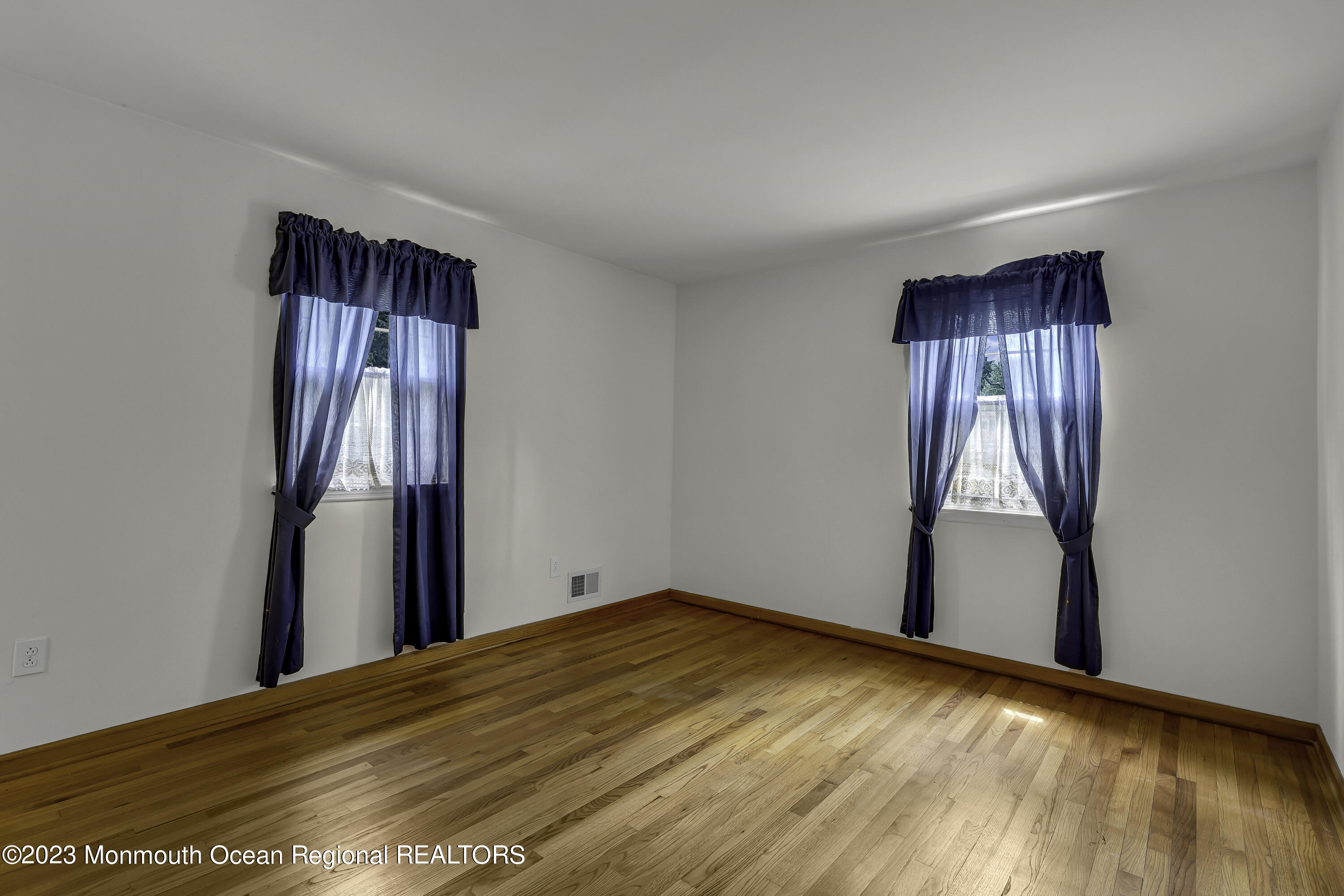 388 Cherry Quay Road Brick, NJ 08723 - Photo 16 of 35 a view of empty room with wooden floor