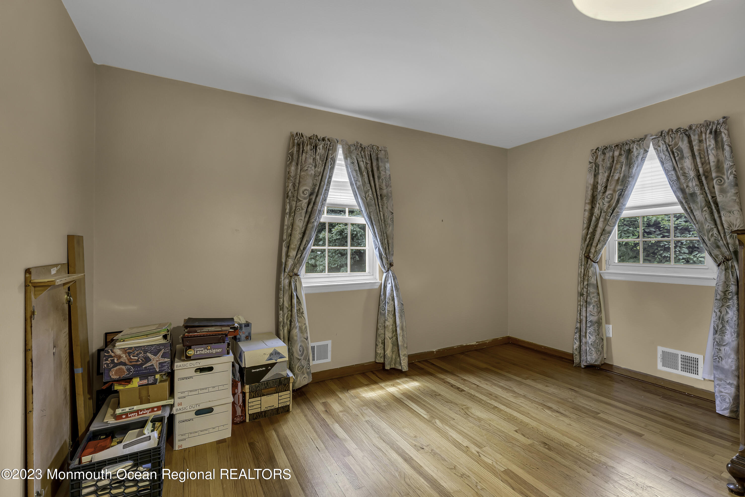388 Cherry Quay Road Brick, NJ 08723 - Photo 23 of 35 a view of a bedroom with workspace and a window