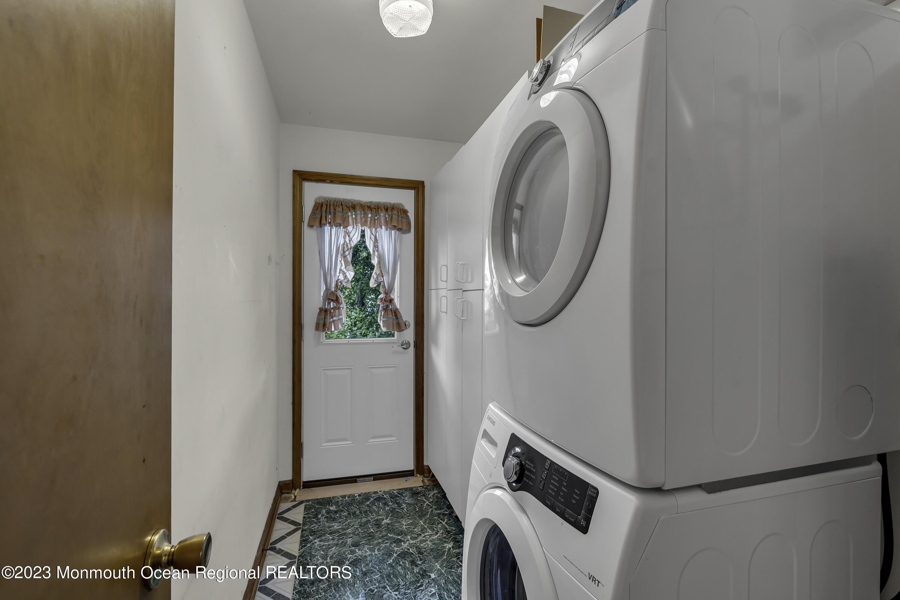 388 Cherry Quay Road Brick, NJ 08723 - Photo 25 of 35 a view of a storage and utility room with washer and dryer