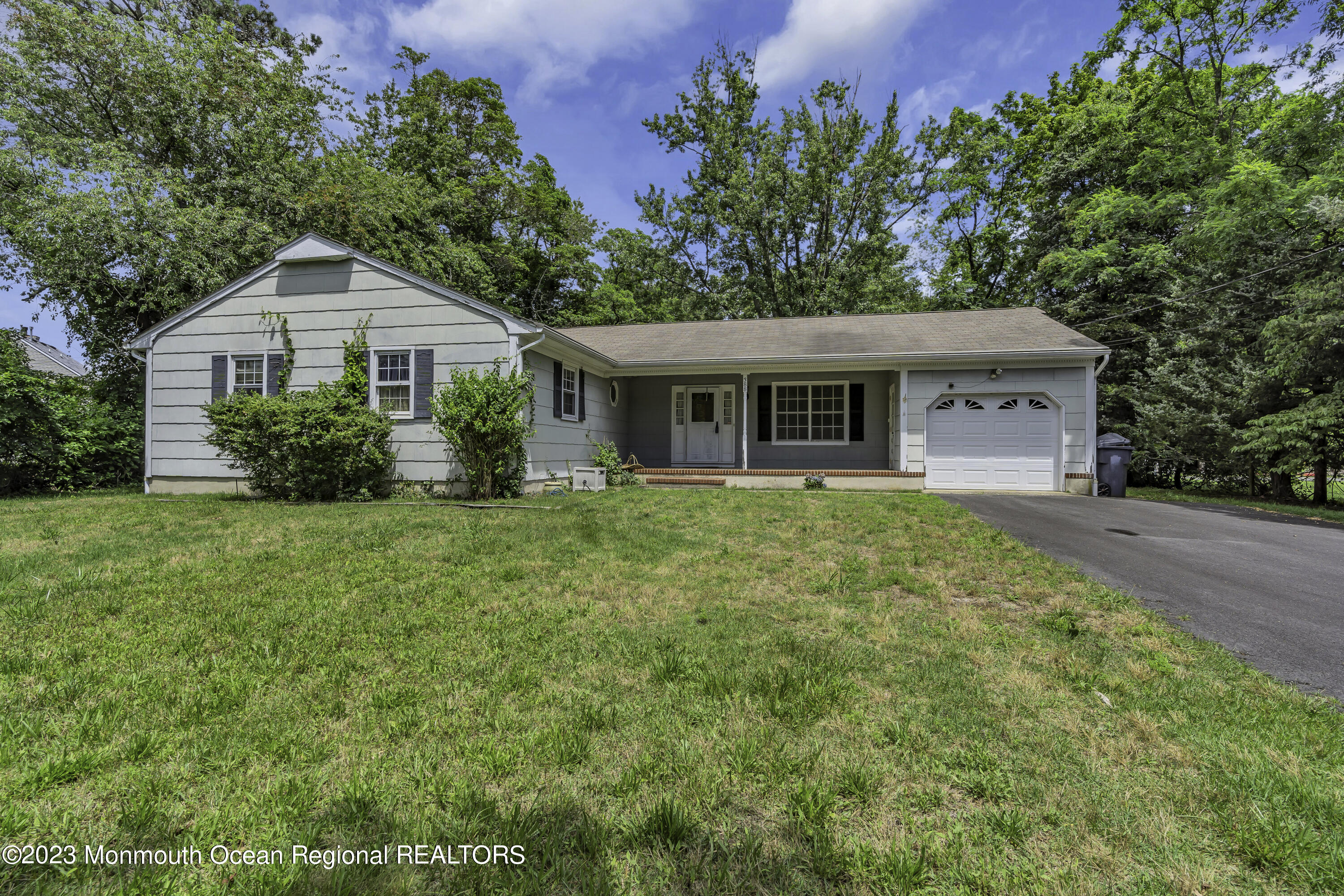 388 Cherry Quay Road Brick, NJ 08723 - Photo 28 of 35 a front view of a house with a yard and potted plants