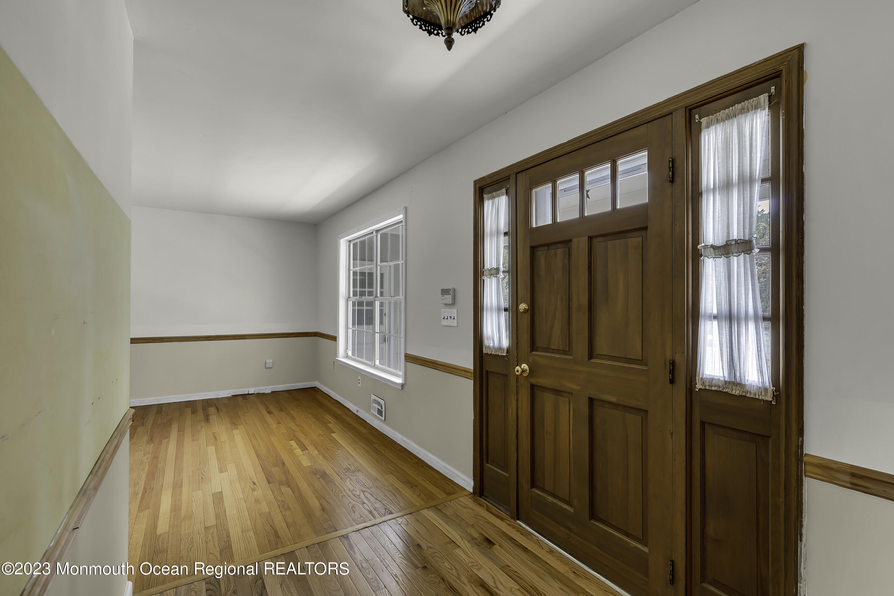 388 Cherry Quay Road Brick, NJ 08723 - Photo 3 of 35 wooden floor in an empty room with a window