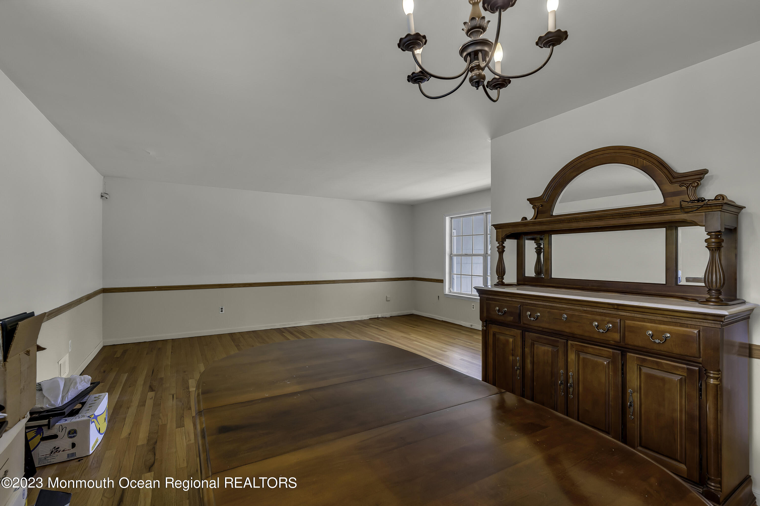 388 Cherry Quay Road Brick, NJ 08723 - Photo 7 of 35 a bedroom with a bed and a chandelier