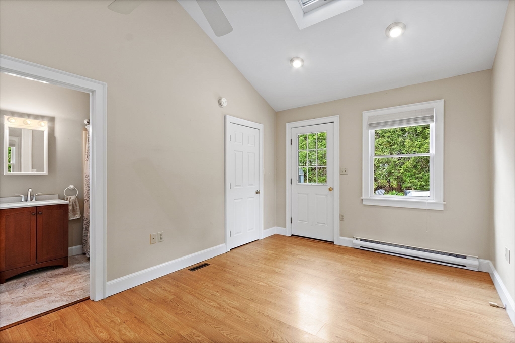 61 Pine Ridge Drive Franklin, MA 02038 - Photo 9 of 41 an empty room with wooden floor and windows