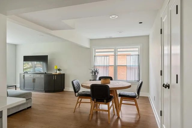 a view of a dining room with furniture and window