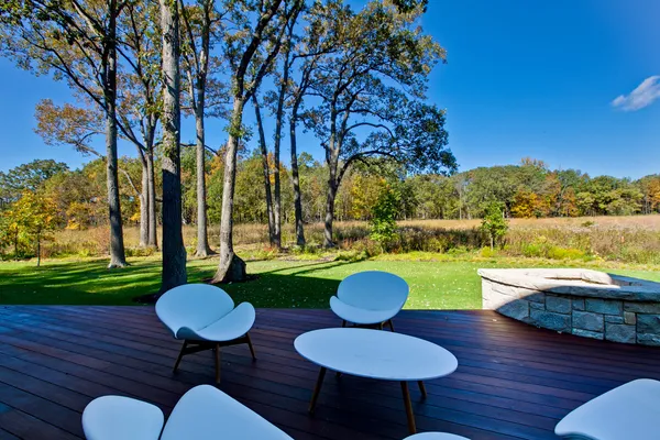 a view of a fountain in the backyard of house