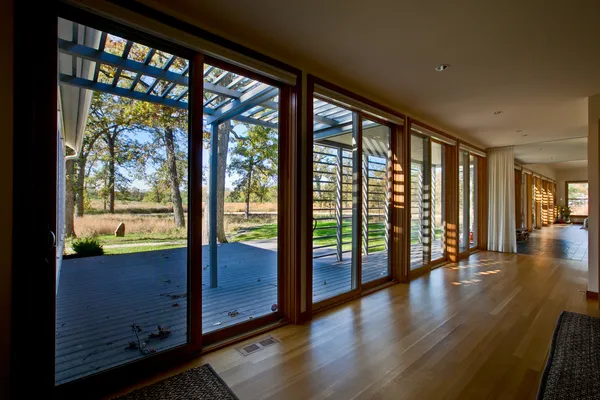 a view of house with a garden and swimming pool