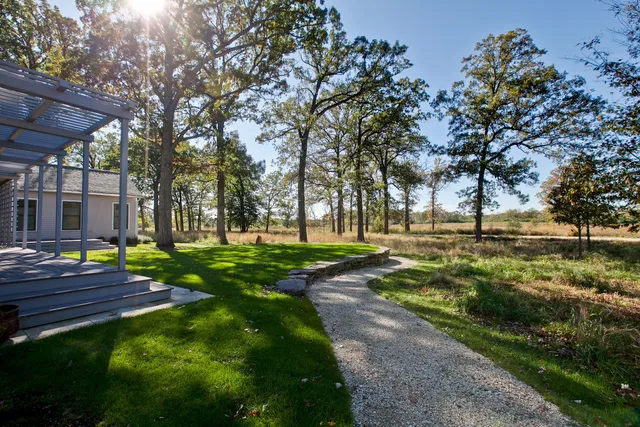 a view of yard from deck having patio