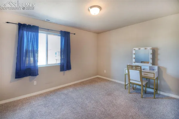 a room with a table and a chair