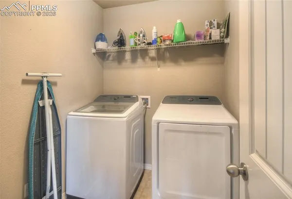a utility room with dryer and washer