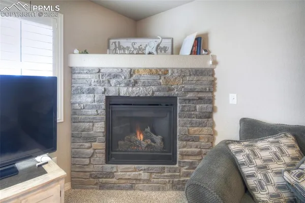 a living room with a fireplace