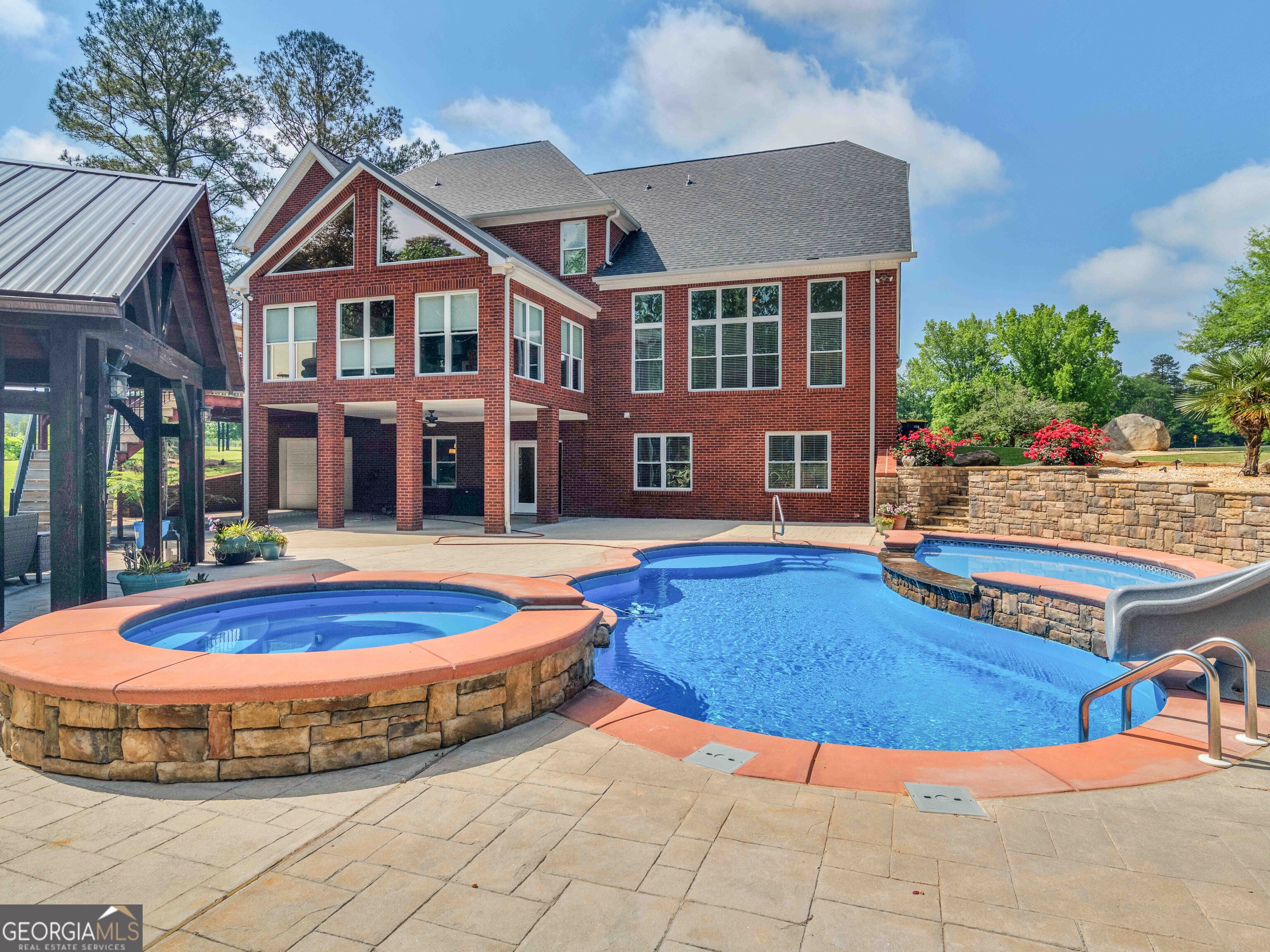 4101 West Ellis Road Griffin, GA 30223 - Photo 12 of 100 a view of a house with swimming pool and porch
