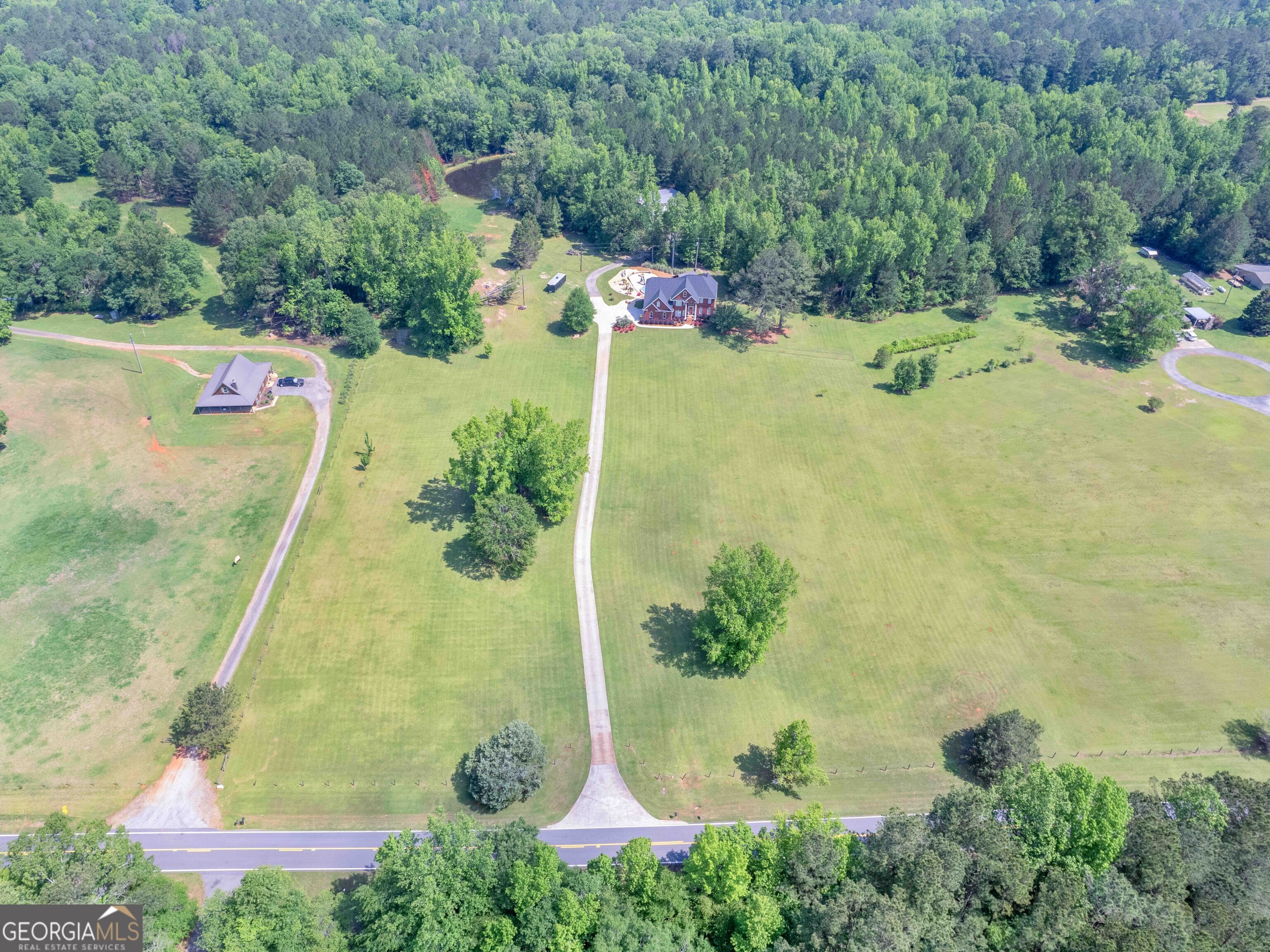 4101 West Ellis Road Griffin, GA 30223 - Photo 21 of 100 an aerial view of a house with a yard and lake view