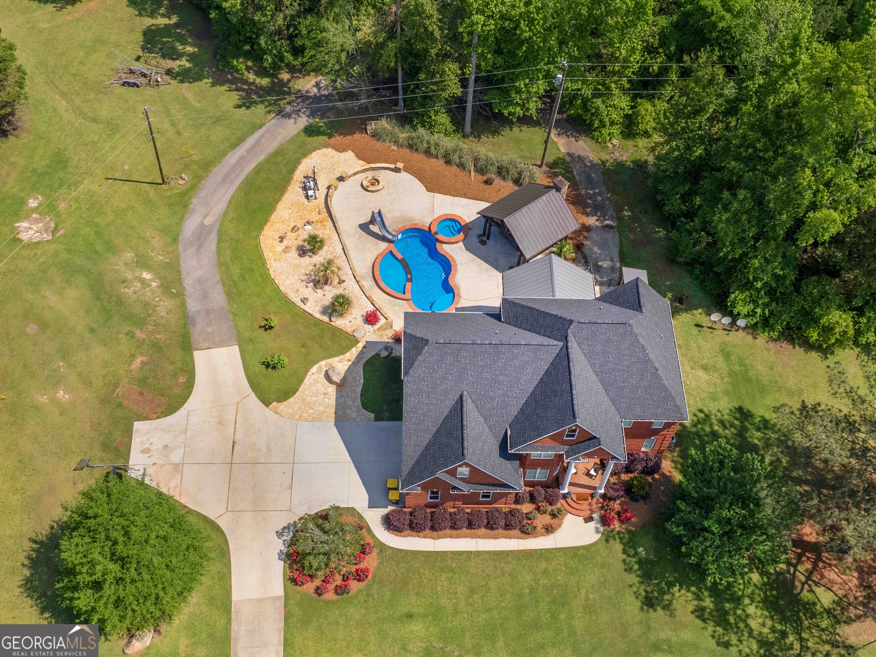 4101 West Ellis Road Griffin, GA 30223 - Photo 22 of 100 an aerial view of a house with swimming pool and outdoor seating
