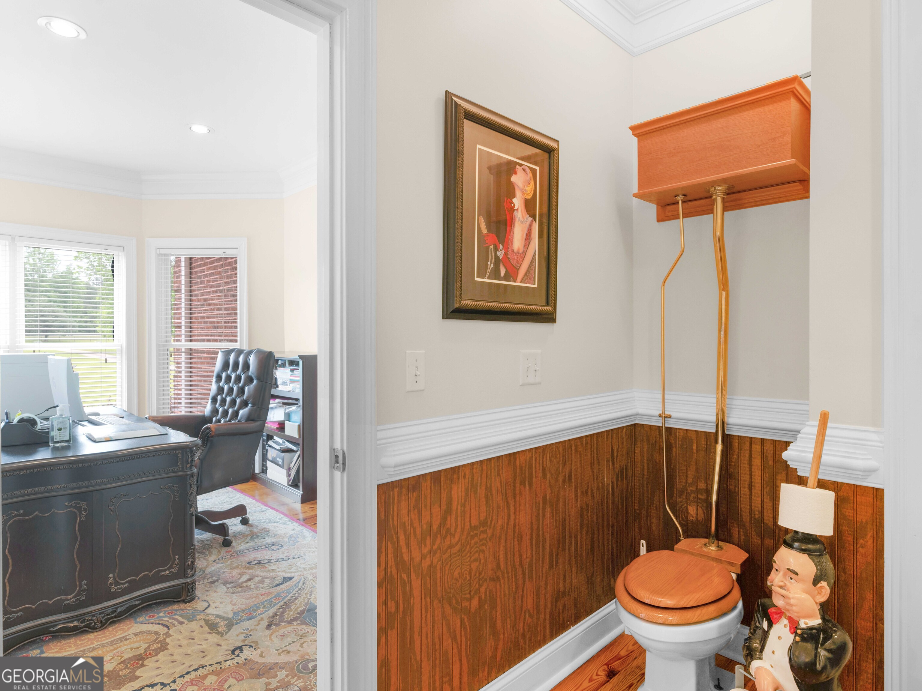 4101 West Ellis Road Griffin, GA 30223 - Photo 31 of 100 a bathroom with a toilet a sink and a mirror