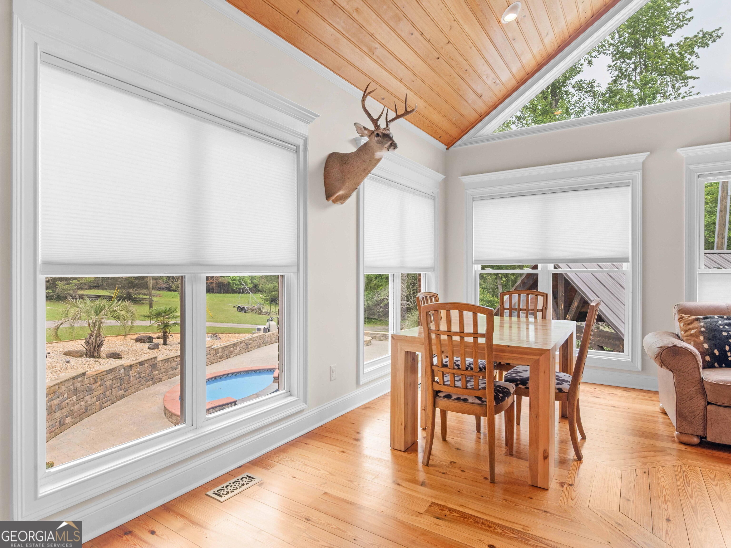 4101 West Ellis Road Griffin, GA 30223 - Photo 47 of 100 a view of a dining room with furniture window and wooden floor