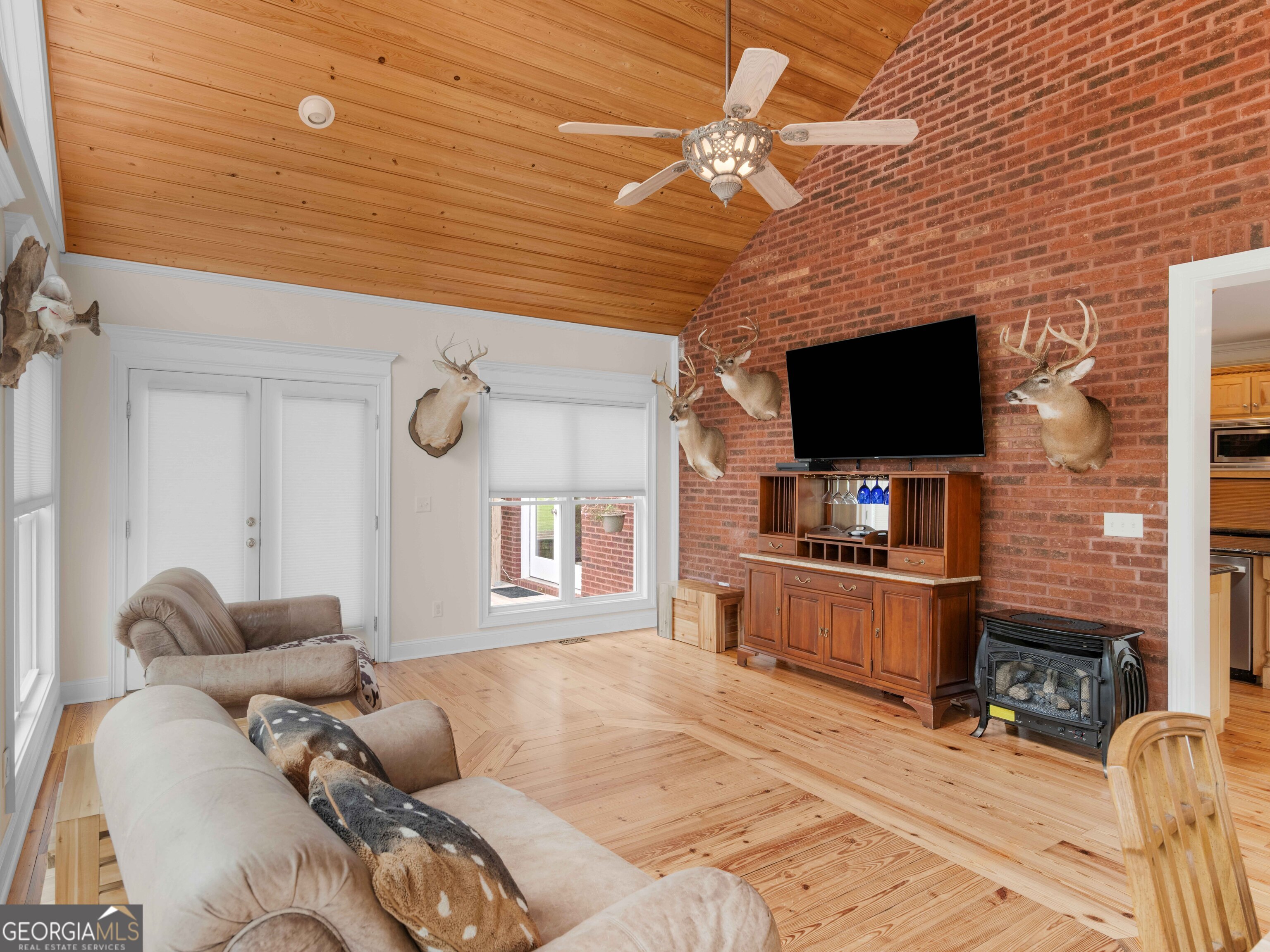4101 West Ellis Road Griffin, GA 30223 - Photo 50 of 100 a living room with furniture and a flat screen tv