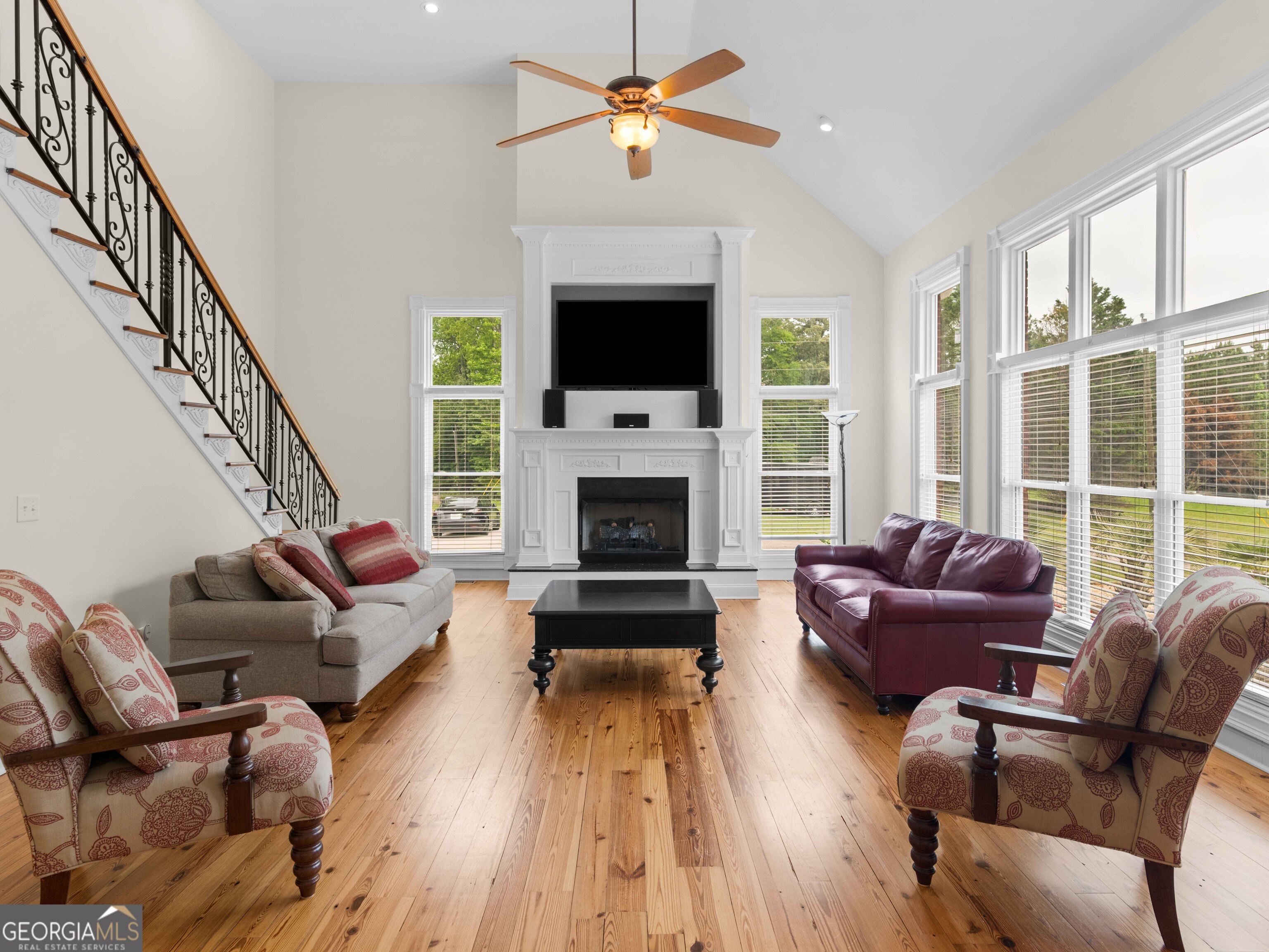 4101 West Ellis Road Griffin, GA 30223 - Photo 52 of 100 a living room with furniture a flat screen tv and a fireplace