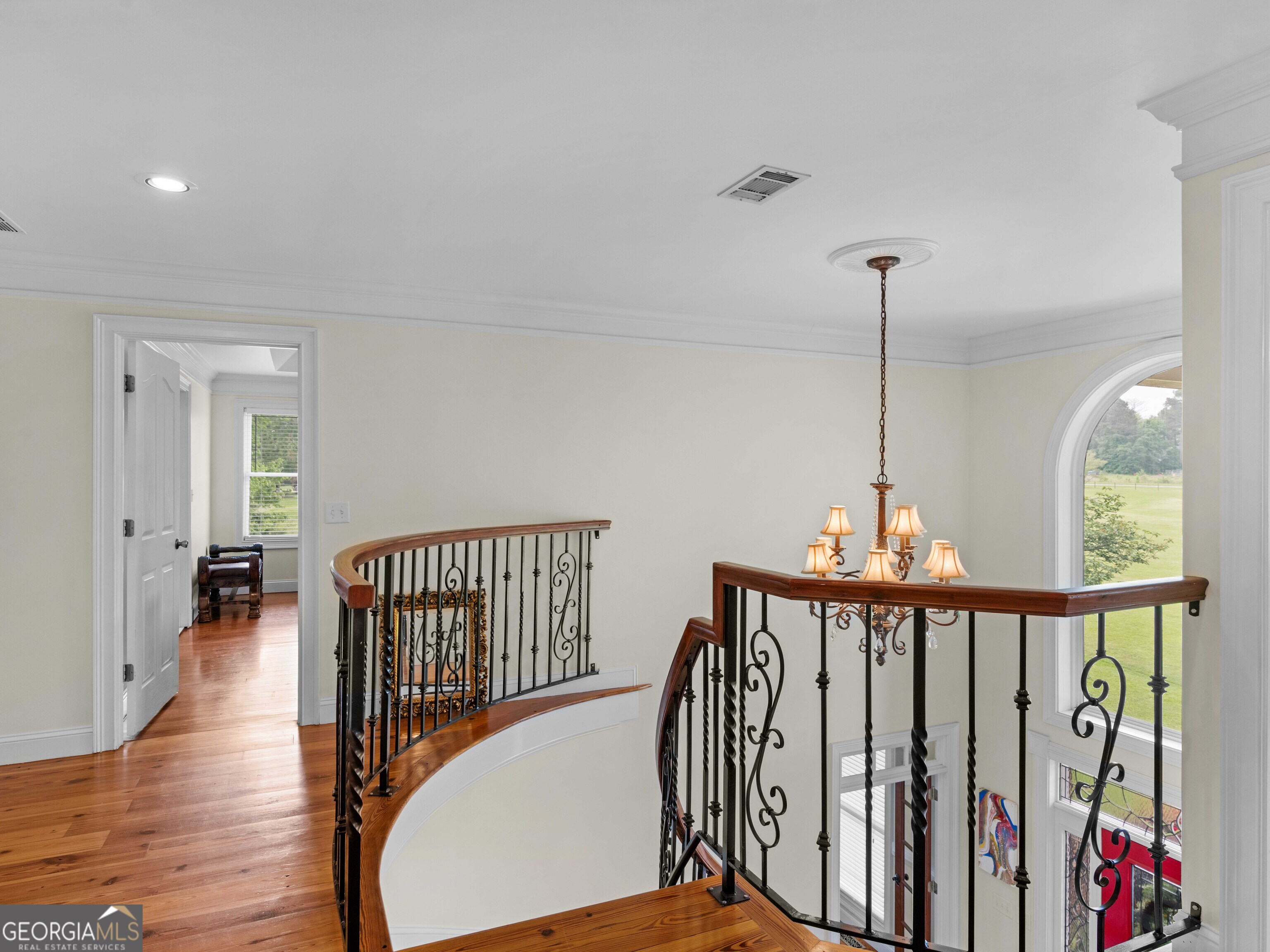 4101 West Ellis Road Griffin, GA 30223 - Photo 59 of 100 a view of a hallway with wooden floor and windows