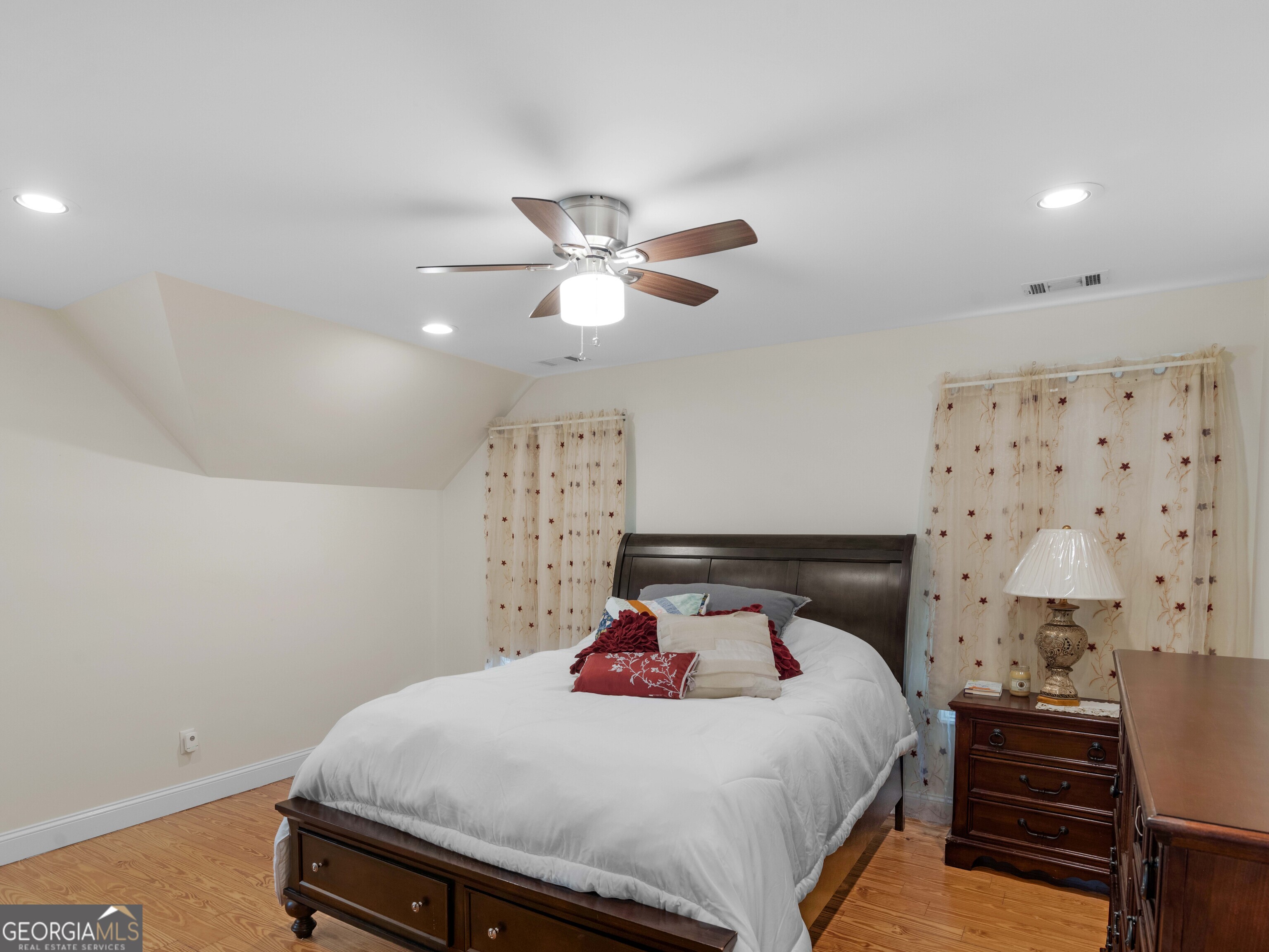 4101 West Ellis Road Griffin, GA 30223 - Photo 64 of 100 a bedroom with a bed and a chandelier