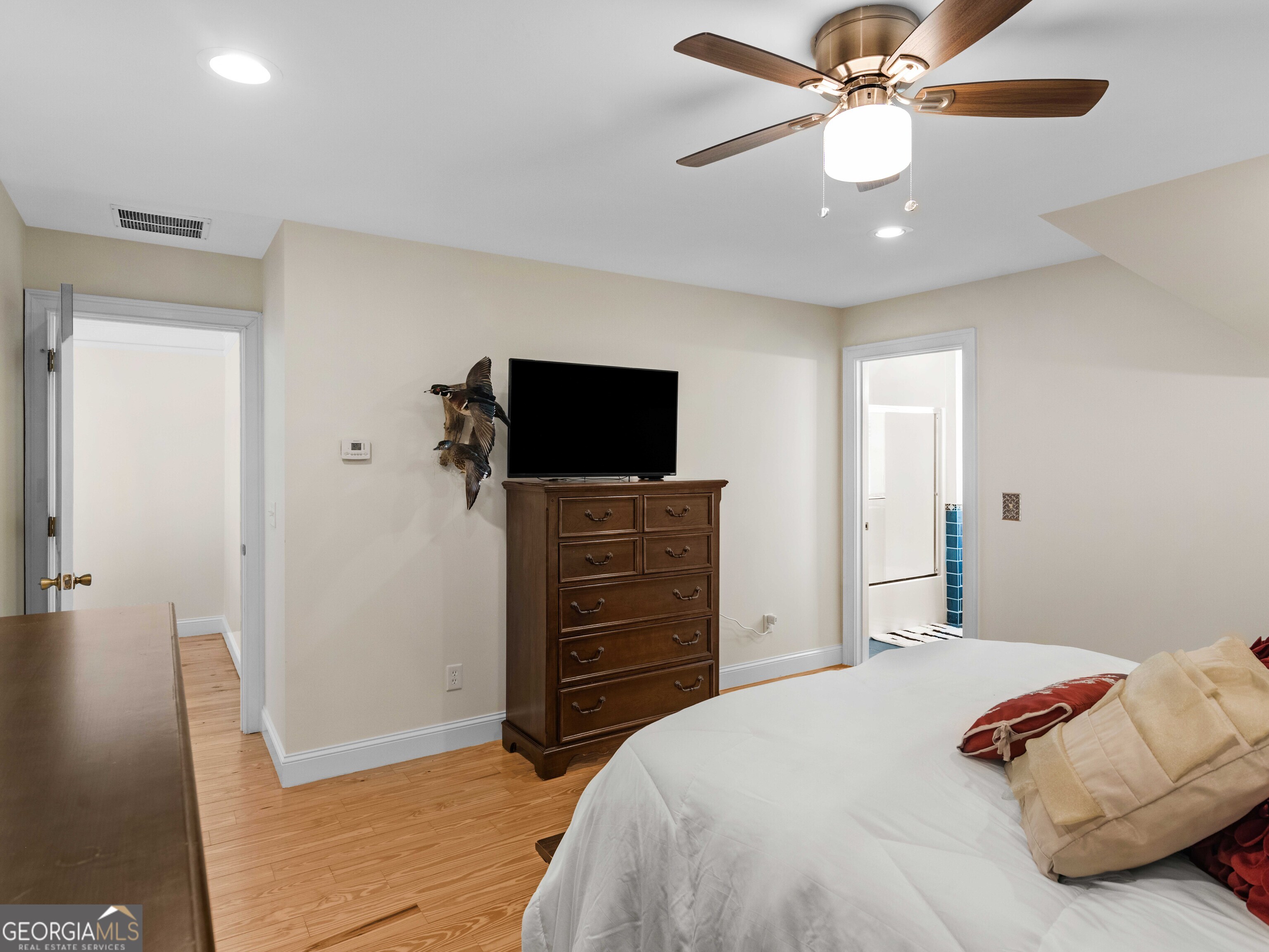 4101 West Ellis Road Griffin, GA 30223 - Photo 65 of 100 a bedroom with a bed and a flat screen tv