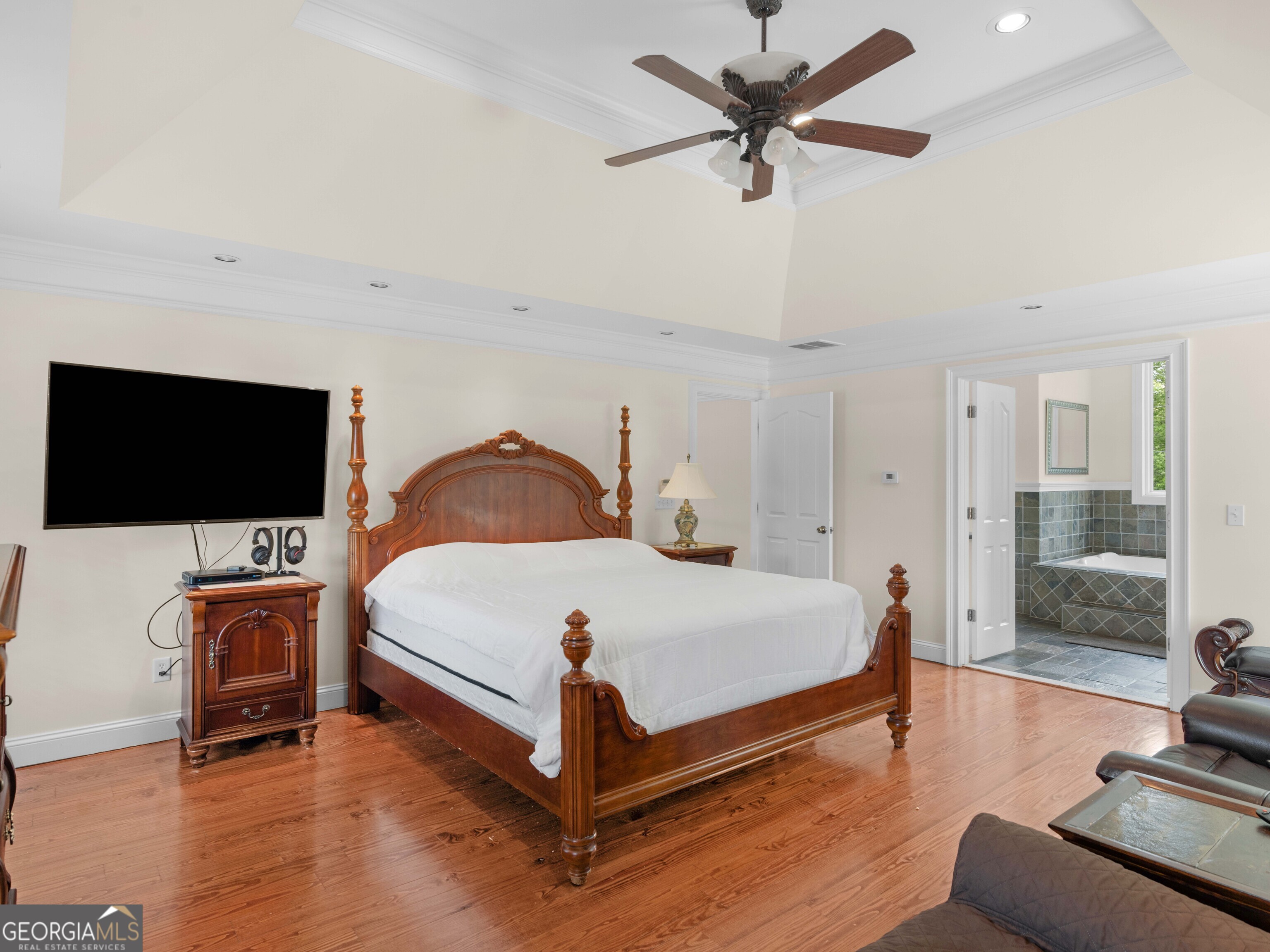 4101 West Ellis Road Griffin, GA 30223 - Photo 77 of 100 a bedroom with a bed and a flat screen tv