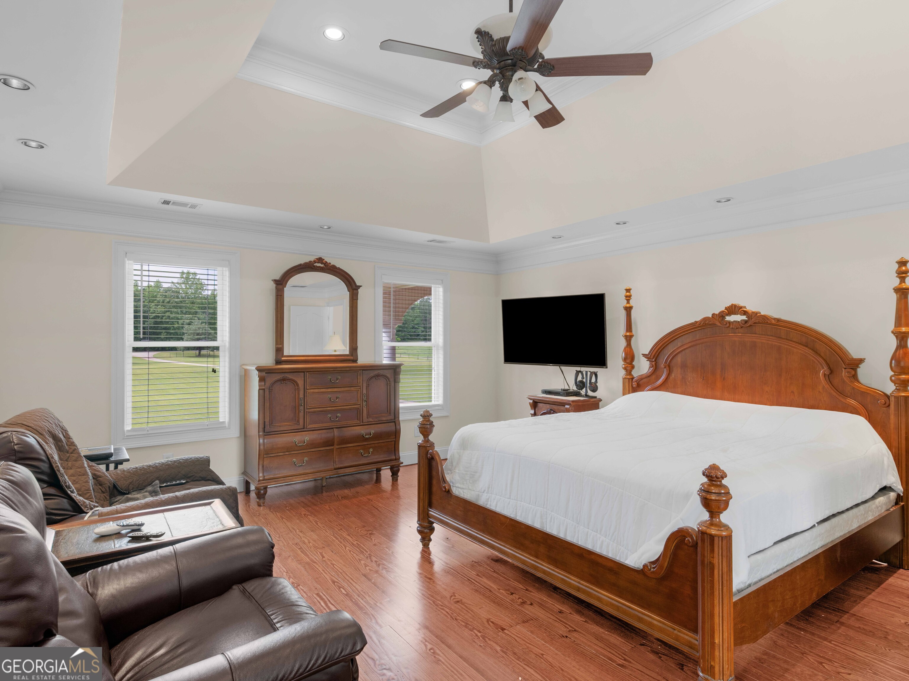 4101 West Ellis Road Griffin, GA 30223 - Photo 78 of 100 a bedroom with a bed couch and a flat tv screen