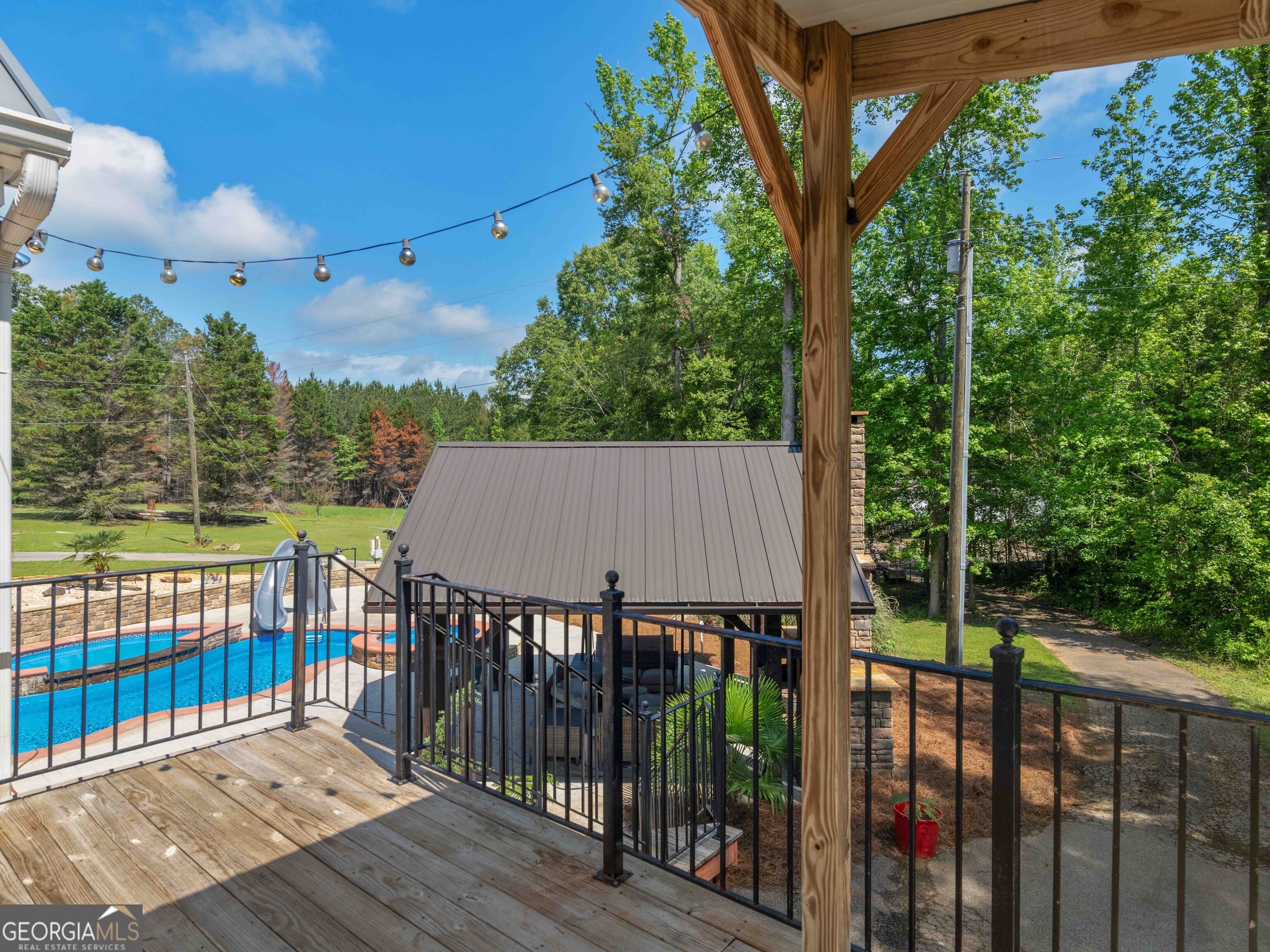 4101 West Ellis Road Griffin, GA 30223 - Photo 8 of 100 a view of a wooden roof deck