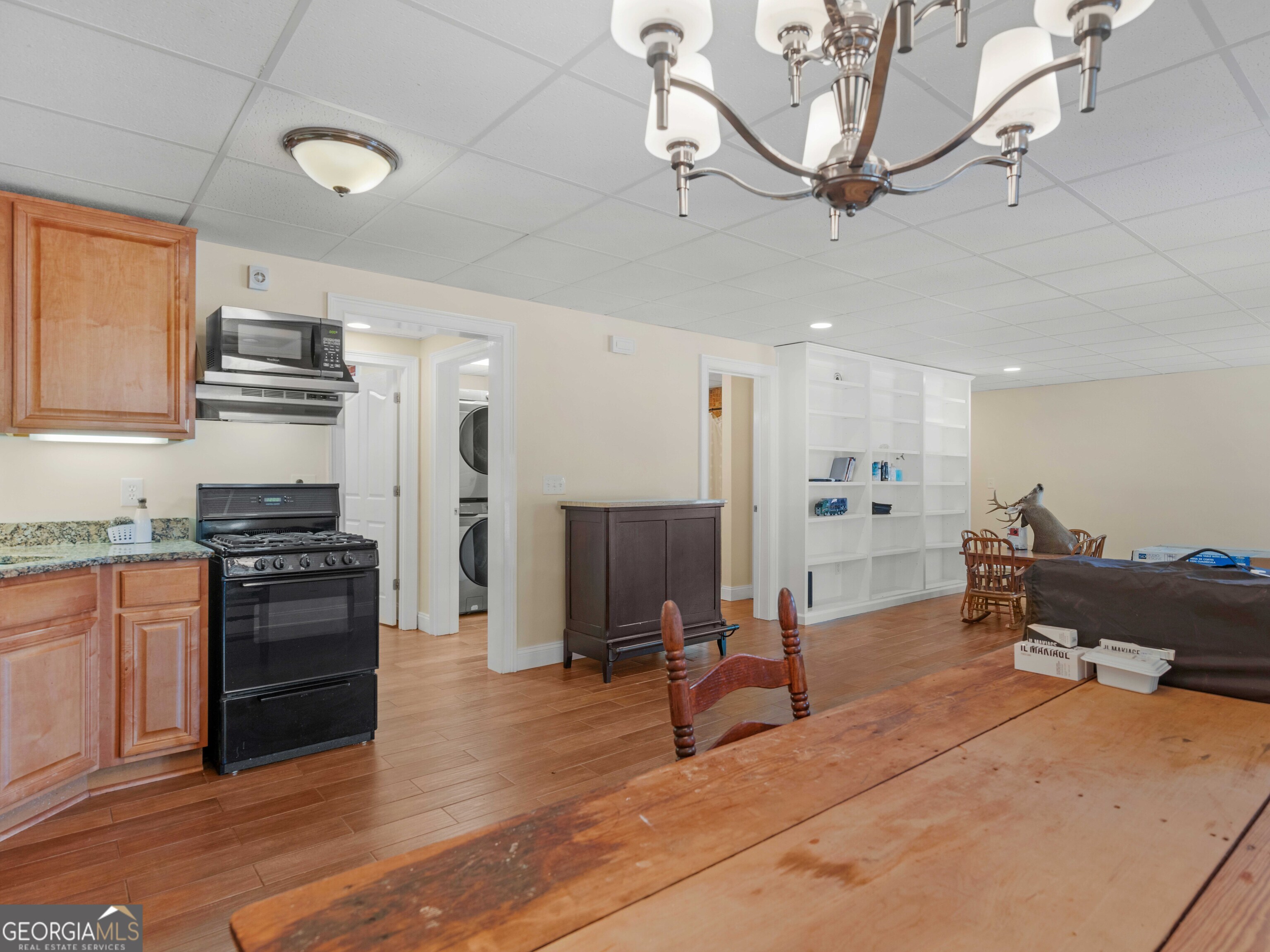 4101 West Ellis Road Griffin, GA 30223 - Photo 86 of 100 a kitchen with stainless steel appliances kitchen island granite countertop a refrigerator and a stove top oven