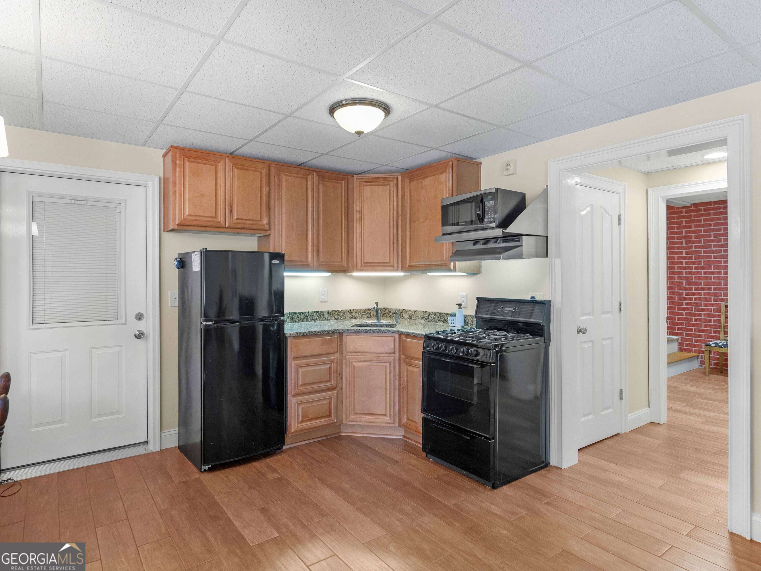 4101 West Ellis Road Griffin, GA 30223 - Photo 87 of 100 a kitchen with stainless steel appliances granite countertop a refrigerator stove and sink