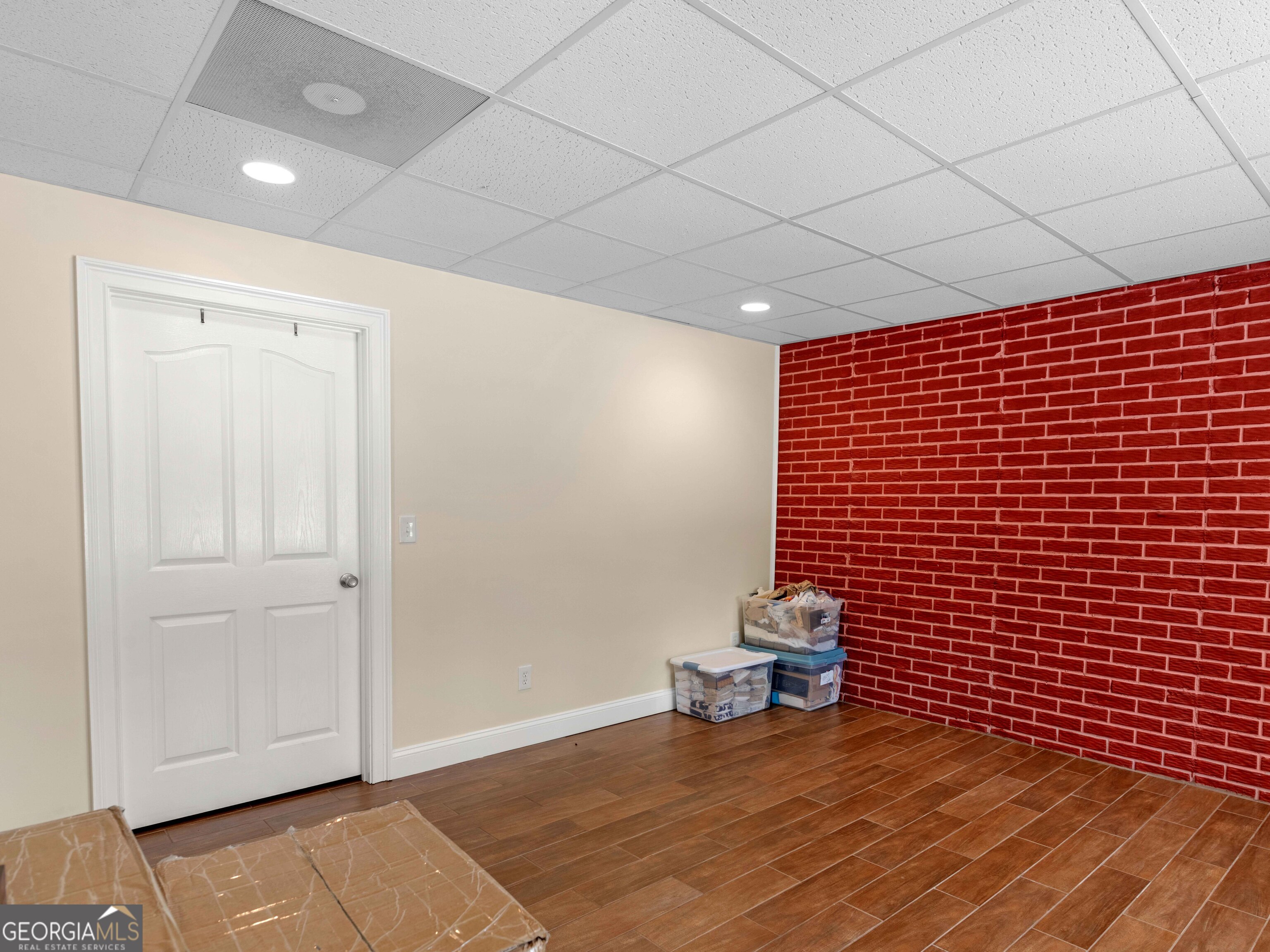 4101 West Ellis Road Griffin, GA 30223 - Photo 93 of 100 a view of an empty room with wooden floor