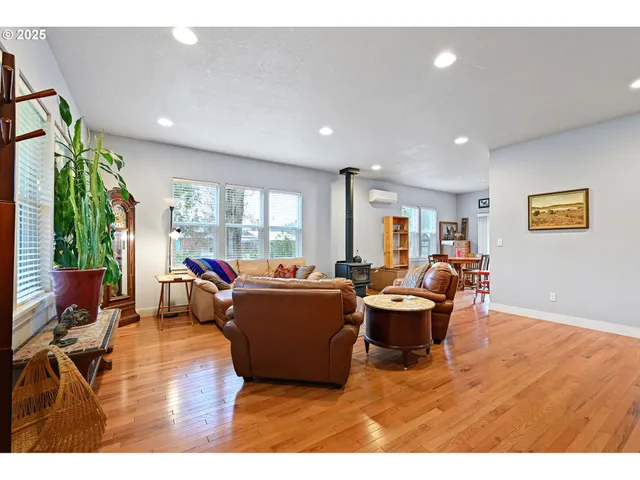 a living room with furniture a window and a dining table