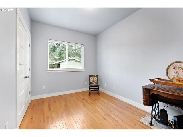 a room with a window and a chair