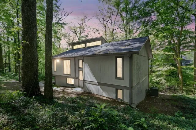 a house with trees in front of it