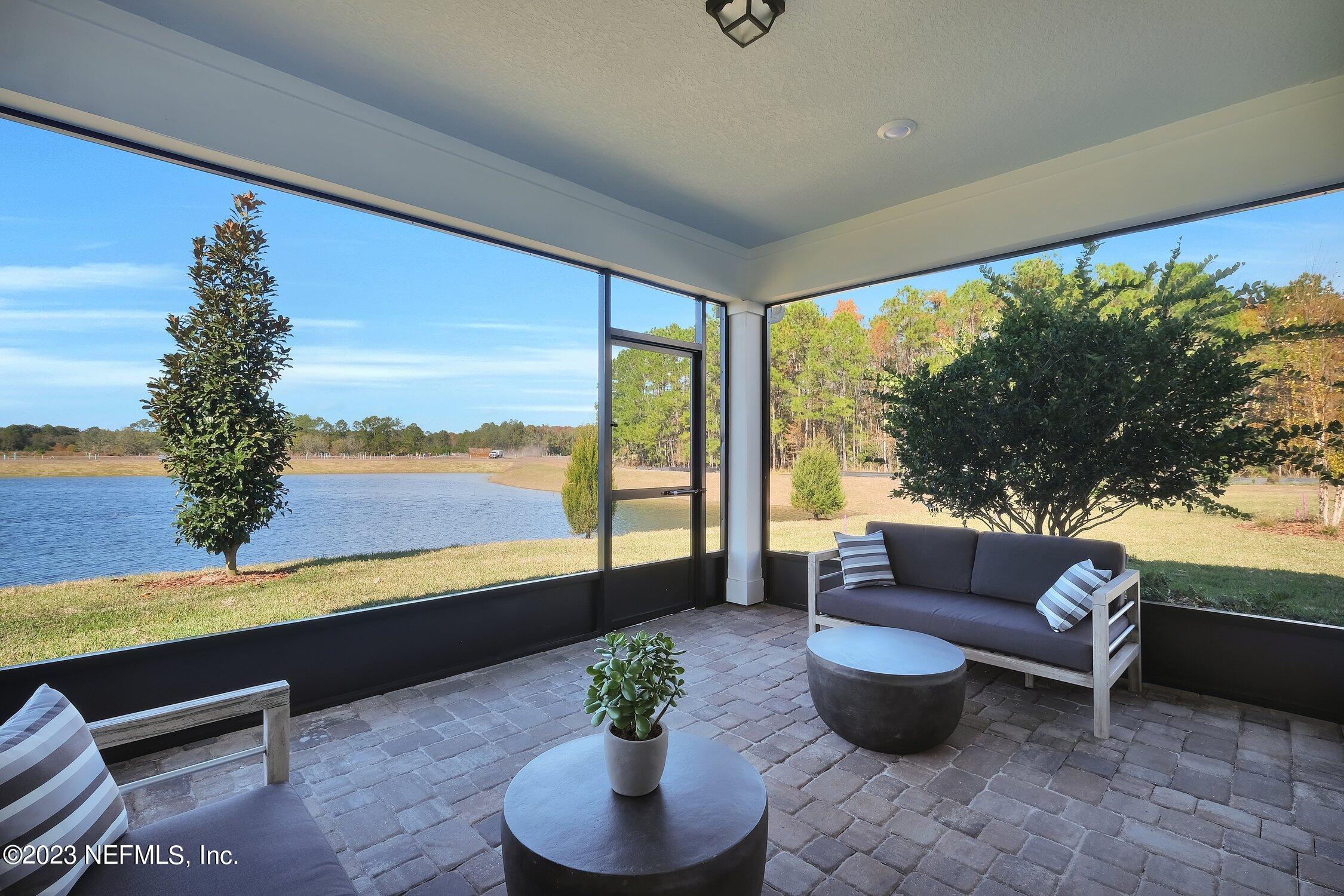 30 Sandy Palm Trail St. Augustine, FL 32086 - Photo 22 of 23 a living room with furniture and a large window