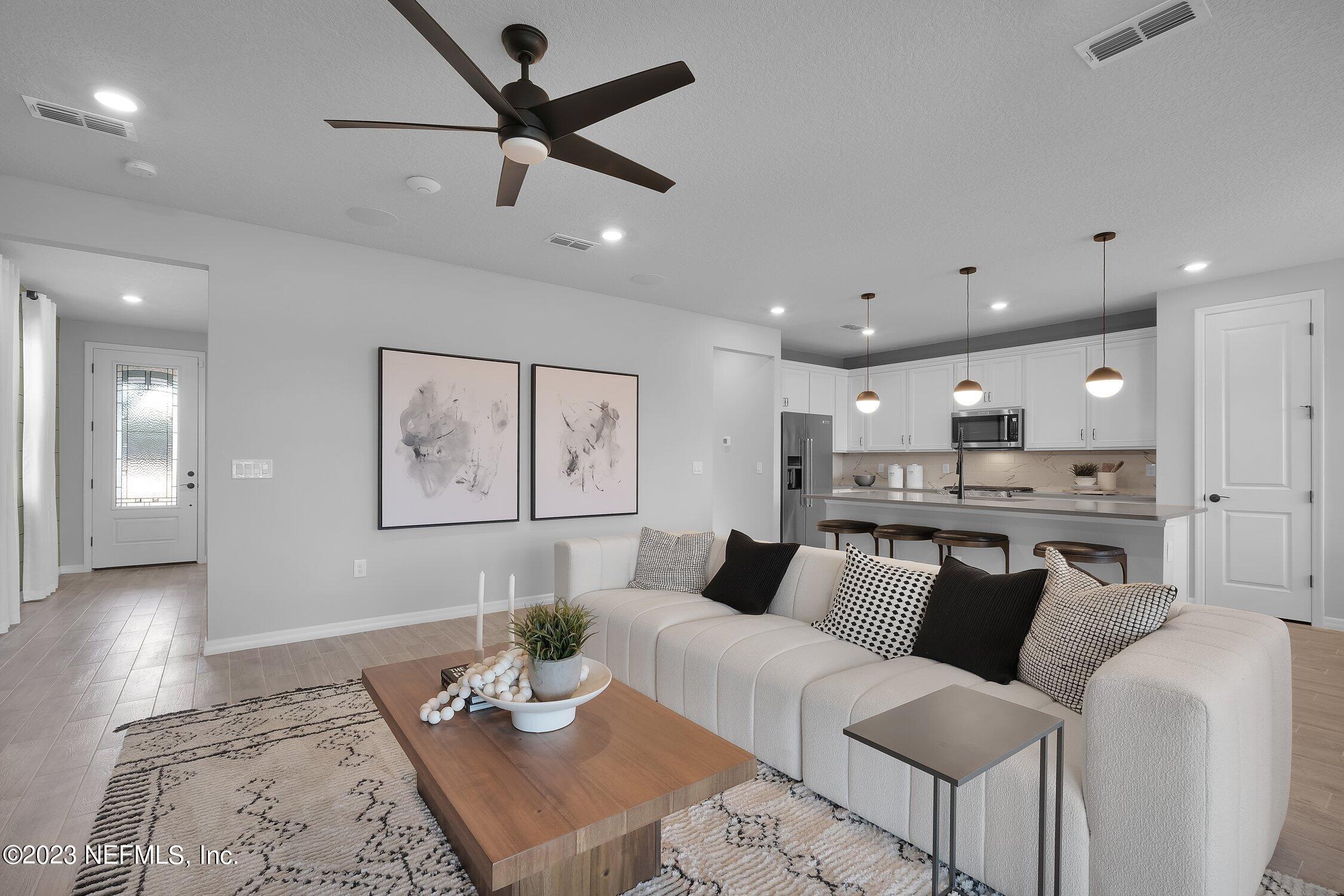 30 Sandy Palm Trail St. Augustine, FL 32086 - Photo 7 of 23 a living room with furniture and kitchen view