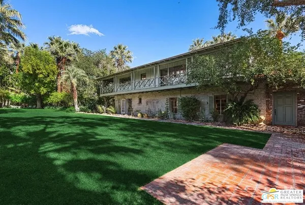 a view of a back yard of the house