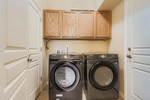 a view of storage and utility room with washer and dryer