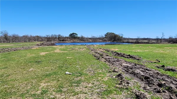 a view of a lake in front of a house
